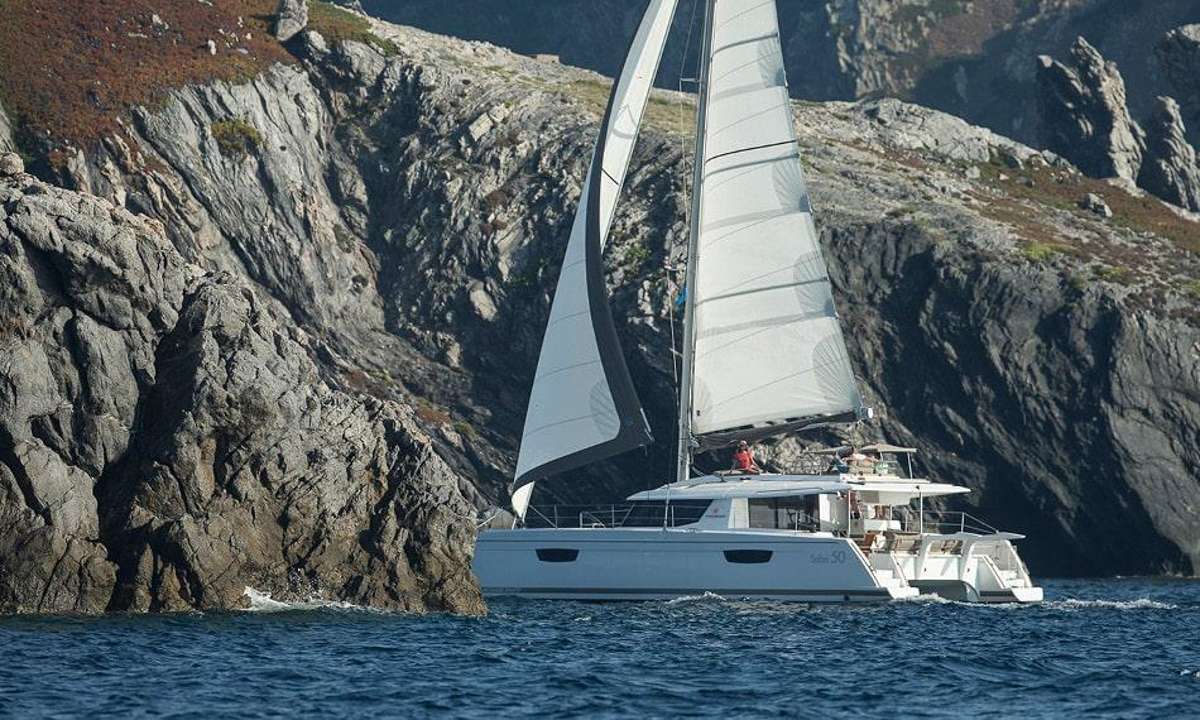 Experience the pinnacle of luxury with the 2017 50' Fountaine Pajot sailing catamaran, Iara, exquisitely refurbished in 2023. This stunning vessel boasts a master suite and two queen cabins, accommodating up to six guests in absolute comfort. Each queen cabin features an ensuite bath, providing optimal privacy and convenience.

Step into spacious, light-filled cabins designed for maximum comfort. The expansive saloon is both practical and elegant, featuring a convertible sofa area and a well-appointed galley. With ample storage throughout, you’ll find every corner of this catamaran thoughtfully designed.

Natural light floods the interior through roof and panoramic windows in the saloon, a wide window door leading to the cockpit, and large windows in all cabins. The interior decor exudes coziness, with soft hues and an elegant style that invites relaxation.

Embark on a Caribbean adventure in the Virgin Islands, where relaxation and excitement await. Enjoy an array of water toys, including three stand-up paddleboards, a floating dock, snorkel gear, beach games, and fishing equipment.

This is more than just a vacation; it's the experience of a lifetime. Set sail and create unforgettable memories on our luxurious sailing catamaran.