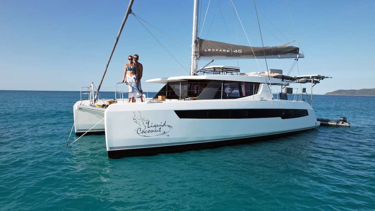 Liquid Coconut is a stunning Leopard 45, launched in 2023, embodying Leopard’s reputation for spaciousness, sturdiness, and remarkable sailing performance. The latest design upgrades provide a perfect balance of comfort and convenience for both crew and guests. The fully opening sliding doors of the main saloon create an expansive, uninterrupted flow between the aft cockpit and the salon, allowing guests to enjoy the yacht’s generous space to the fullest.

The yacht’s air conditioning system can run solely on battery power, ensuring quiet, restful nights without the hum of a generator.

What truly elevates the Liquid Coconut experience is the outstanding crew: Kemble and Lindi, known for their exceptional hosting skills and numerous delighted guests. Their fun-loving personalities and expertise in watersports make every voyage memorable. Kemble, a dive master with proficiency in surfing, kitesurfing, and wingfoiling, ensures adventure at every stop, while Lindi’s passion for snorkeling and culinary expertise delights with a blend of modern, healthy, and locally-inspired dishes.

Liquid Coconut also explores off-the-beaten-path sailing destinations, including the unique waters of Zanzibar, where guests can enhance their sailing adventure with an unforgettable safari expedition.