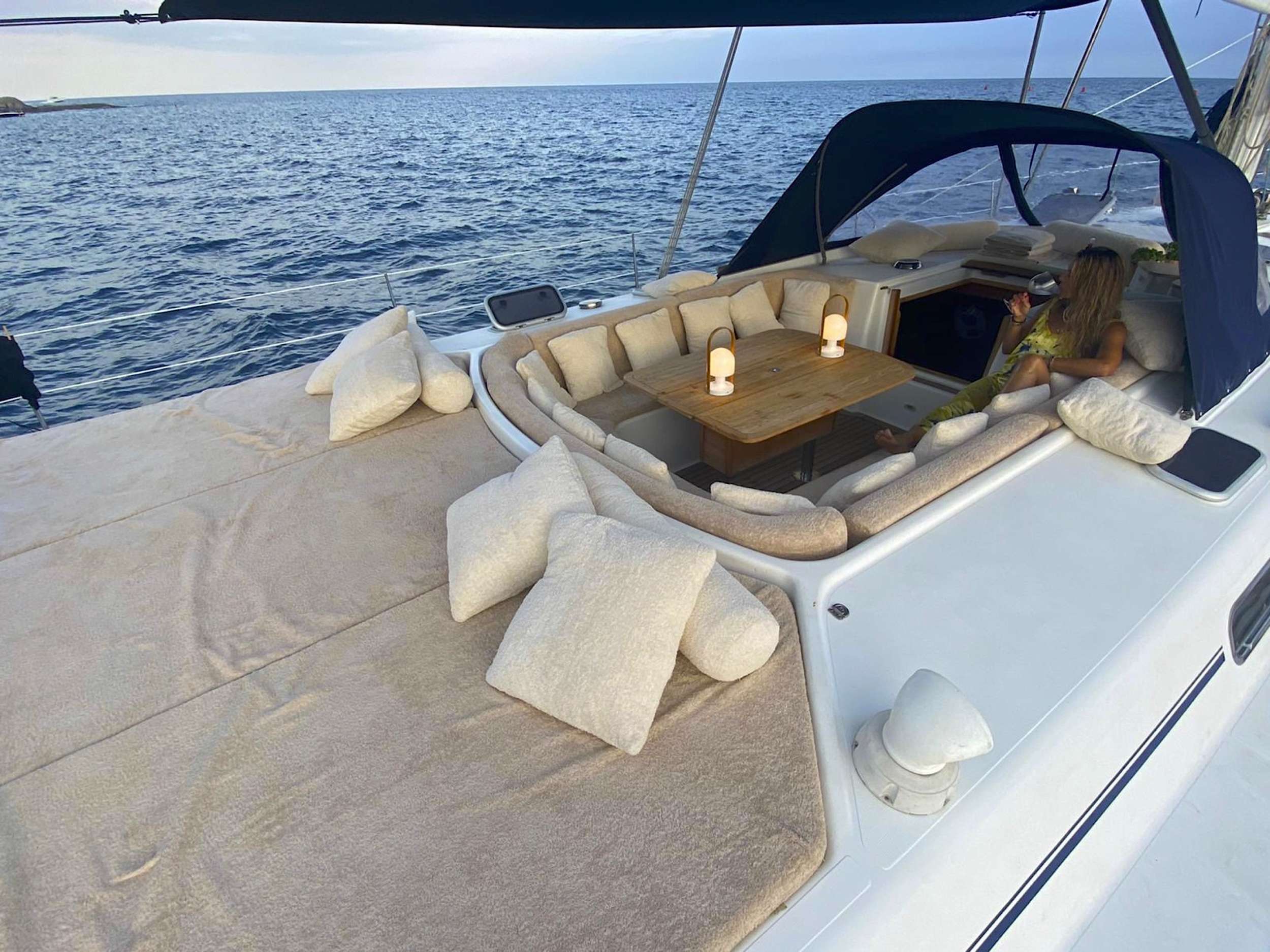 Lounging cockpit with sun mats aft.