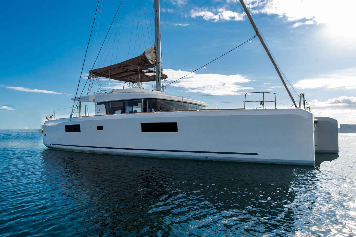 The Lagoon 52 ACE OF HEARTS, built in 2018 and fully refitted in 2025, is a stunning catamaran designed for an unparalleled yachting experience. Accommodating up to 12 guests in 5 double cabins and 1 bunkbed cabin, this yacht is perfect for large families or groups. With 2 professional crew members providing full board service, guests can expect top-notch hospitality throughout their cruise. The Lagoon 52 is celebrated for its innovative design, exceptional performance, and luxurious comfort. This model boasts a spacious flybridge, generous deck areas, and a contemporary interior with large windows that flood the space with natural light and provide breathtaking panoramic views. With its sleek lines and advanced sailing capabilities, the Lagoon 52 ACE OF HEARTS offers a unique and memorable yachting experience, whether you're exploring tranquil waters or visiting picturesque destinations.