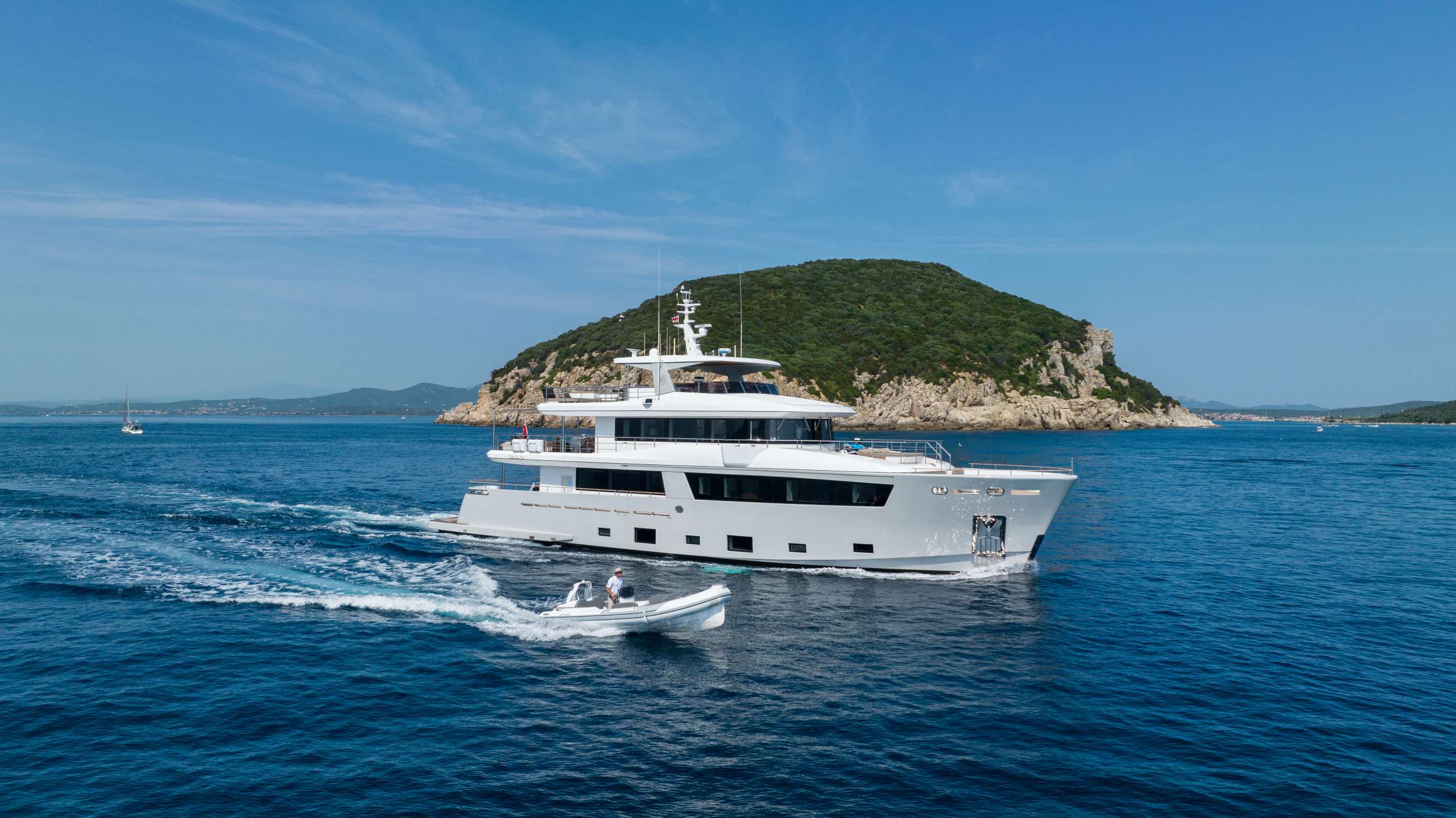 The SABAI is an exquisite 33.8-meter tri-deck charter yacht, built by Cantiere Delle Marche in 2019 and recognized with the prestigious 2019 Boat International Design and Innovation Award. Combining boho-luxe interiors with innovative design, the yacht seamlessly merges comfort and sophistication. Its fluid architectural lines and natural tones create a harmonious environment that blends effortlessly with the surrounding ocean.

The yacht accommodates 10 guests in five luxurious staterooms, including a master suite on the main forward deck and four additional spacious staterooms amidships. Deluxe Pullman beds add flexibility for additional guests. The floating glass staircase, a centerpiece of the design, connects the levels with a sense of elegance and airiness.

Guests can indulge in the sundeck's illuminated glass-walled jacuzzi, offering panoramic views and a serene retreat. Surrounding it are plush sunpads and ample leisure space for socializing or relaxing. Adjacent to this area is a covered alfresco dining and bar space, providing shelter from the wind while maintaining a strong connection to the outdoors. The main salon, designed for lounging, flows effortlessly into the open sundeck, while the upper salon features a formal dining area centered around a striking table.

The dedicated crew of six ensures every need is met, while the onboard chef prepares gourmet meals tailored to guests' dietary preferences. Whether seeking laid-back elegance or thrilling water sports, SABAI delivers an unforgettable charter experience.